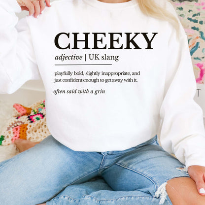 Person wearing a white sweatshirt with 'CHEEKY' definition text, sitting on a colorful couch.