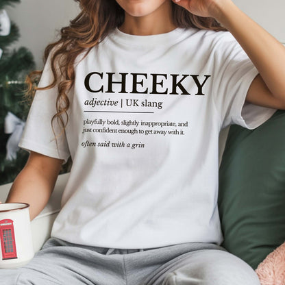Person wearing a white t-shirt with 'CHEEKY' definition text, holding a mug.