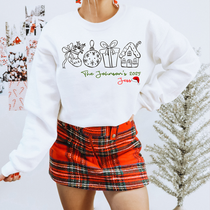 Person wearing a white sweatshirt with Christmas-themed designs and a red plaid skirt.