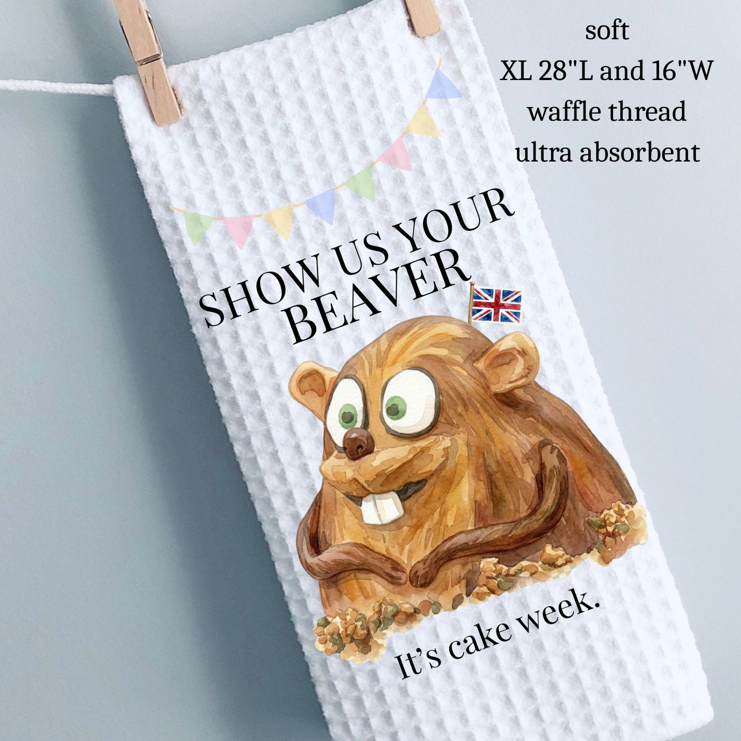 Waffle-textured towel with a cartoon beaver and text on a gray background