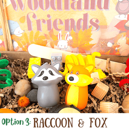 Raccoon and Fox vinyl finger puppets inside sensory box 