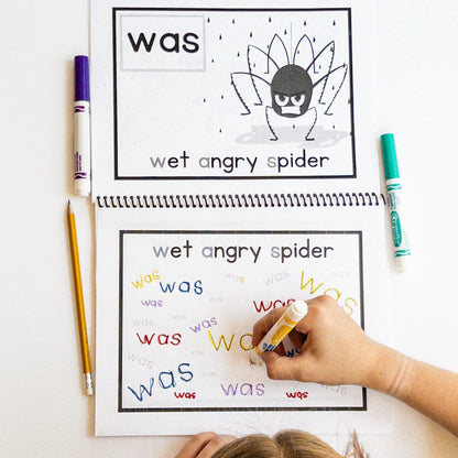 children completing a spelling workbook